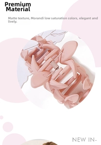 Macro detail of large matte Morandi pink floral hair claw clip with elegant texture