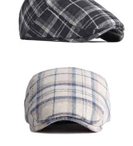 Close-up of classic plaid wool newsboy caps showing detailed texture and patterns