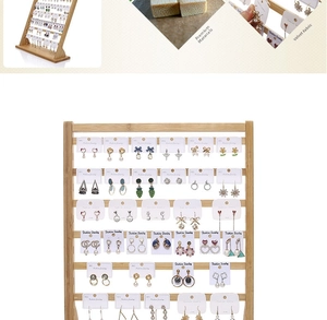 Detailed view of bamboo earring display stand with velvet stitching and card slots
