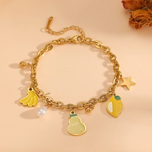 Golden stainless steel bracelet with lemon, banana charms and elegant faux pearls