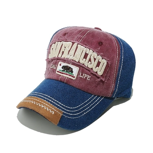 Detailed view of the distressed patchwork baseball cap with polar bear embroidery