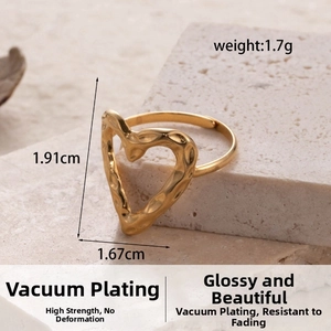 Detail of gold hammer-textured heart ring with dimensions 1.91cm by 1.67cm, weight 1.7g