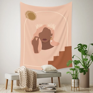 Detail of bohemian wall tapestry with abstract female portrait in warm earth tones