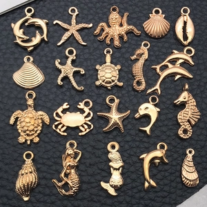 Set of 20 golden ocean themed metal charms including starfish and seahorse for DIY jewelry