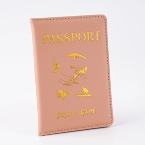 Close-up of pink PU leather passport holder with golden stamped text and sport icons