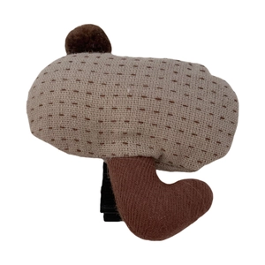 Cute plush mushroom hair clip for children with brown polka dots on a beige fabric finish