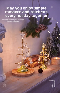Detail of spiral iron Christmas trees with crystal pendants and warm LED star light