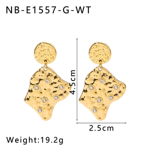 Detail view of irregular lava texture gold earrings with size and weight annotations