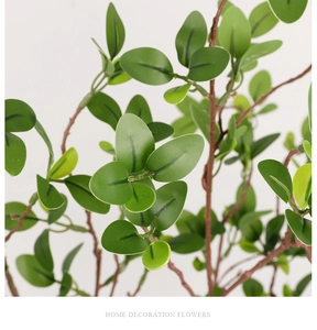 Macro detail of artificial Milan leaf stem with green leaves for home decoration