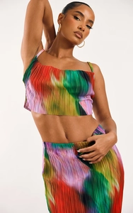 Detailed view of colorful tie-dye pleated fabric on a slim fit two-piece summer set