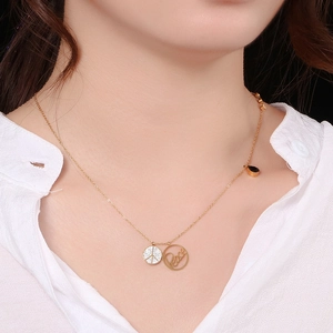 Gold titanium steel peace necklace featuring a crystal-encrusted medallion pendant