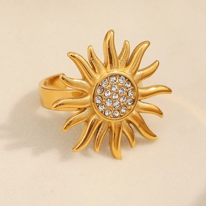 Macro shot of 18K gold plated sunburst ring with sparkling zircon stones in center