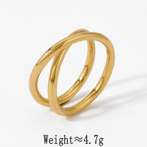 Detailed view of the interlocking golden double bands with smooth polished finish