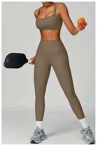 Detail of ribbed yoga set featuring a U-neck sports bra and high-waist leggings in taupe