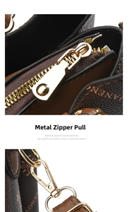 Close-up of golden hardware zipper and metallic hooks on a brown leather handbag
