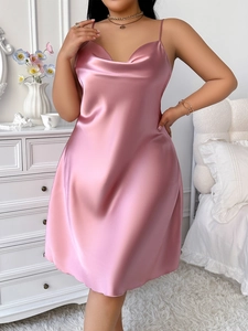 Detail of pink ice silk satin nightgown featuring slim straps and a subtle V-neckline