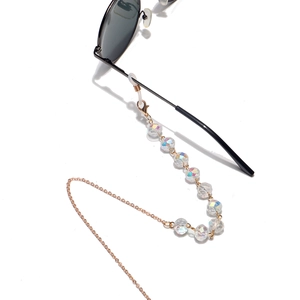 Detail of 10mm flat crystal bead eyewear chain with gold links and silicone loops
