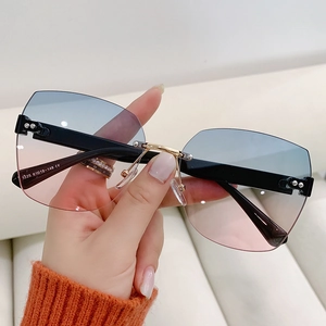 Fashion rimless sunglasses with blue-pink gradient lenses and sleek metal nose bridge