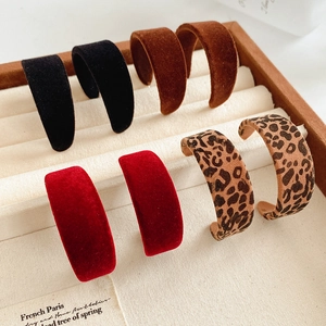 Detailed set of flocking C-shaped earrings in black, brown, red, and leopard prints