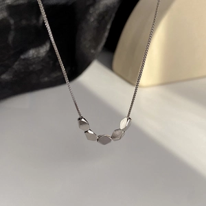 Minimalist silver geometric necklace with five rhombus beads on a thin box chain
