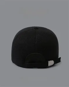 Detail view of winter baseball cap back with premium metal buckle and thick wool texture
