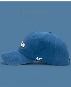 Detail view of cotton baseball cap featuring 3D Art embroidery and side lettering