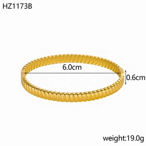 Macro detail of 18K gold plated open bangle showing 6.0cm diameter and 0.6cm width