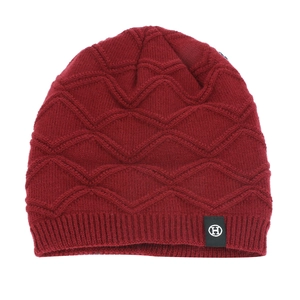 Thick burgundy knit beanie with wave texture and ear protection for outdoor skiing