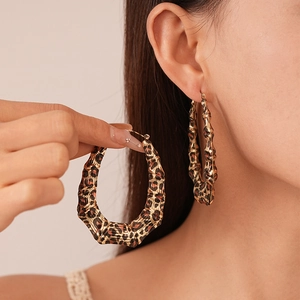 Statement leopard print bamboo hoop earrings for women with bold geometric swirl design