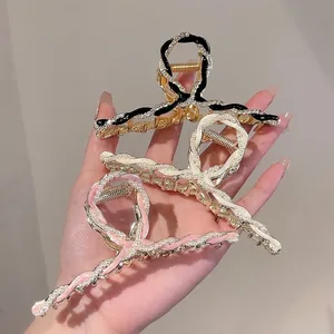 Elegant floral hair claw clips with rhinestones and pearls in gold finish for women