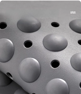 Detail of TPE non-slip bath mat with textured safety beads and round drainage holes