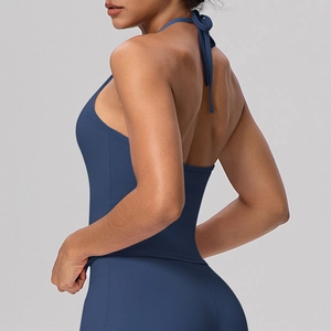 Detail of cross-back straps on dark blue high-stretch yoga top and leggings set