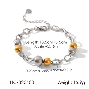 Vue détaillée du bracelet à perles bicolore en acier avec longueur de 18,5cm et mesures