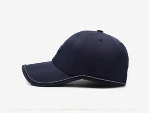Side view of dark blue quick-dry baseball cap with subtle 3D embroidery and grey piping