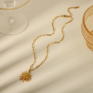 Vintage 18K gold-plated sun pendant necklace on a unique elongated cable link chain