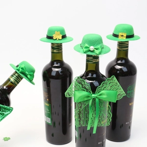 Close-up of mini green velvet top hats with clover accents for St. Patrick's Day wine bottles