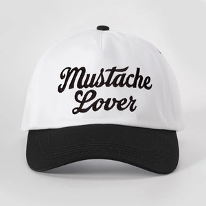 Close-up of Mustache Lover embroidery on the black and white baseball cap crown