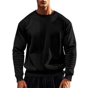 Detail of black crewneck sweatshirt with ribbed texture panel and functional chest pocket