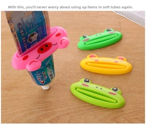 Cartoon animal tube squeezers for toothpaste and cleansers on wooden surface