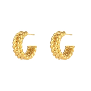Close-up of gold-plated stainless steel earrings with textured wheat pattern texture