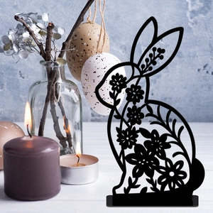 Detail of black hollow Easter bunny acrylic stand with floral patterns and egg decor