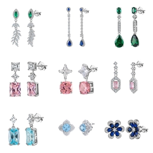 Macro shot of nine S925 sterling silver earrings set with various colored cubic zirconia stones