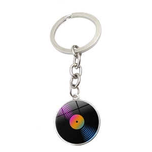 Detail of a vintage vinyl record keychain with a colorful gradient center and metal link chain