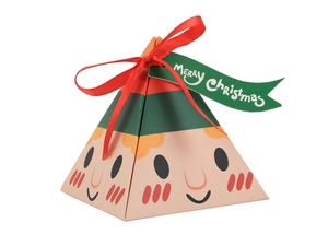 Detail of pyramid Christmas candy box featuring elf face design with red ribbon and tag