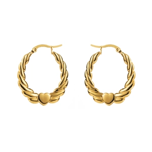 Detail of gold twisted hoop earrings with heart charms and secure latch back closure