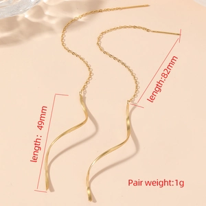 Minimalist gold wavy tassel earrings in stainless steel with elegant spiral drop design