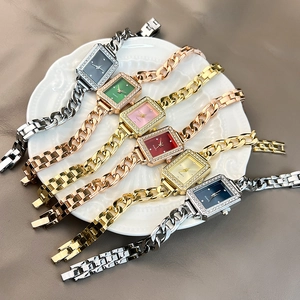 Group of elegant vintage square quartz watches with colorful faces and metal link bracelets