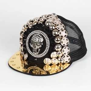 Close-up of hip hop baseball cap with 3D rhinestone skull and golden metal rivets