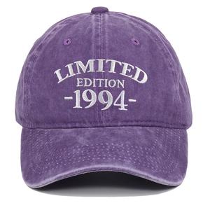 Close-up of white limited edition 1994 embroidery on washed purple cotton baseball cap