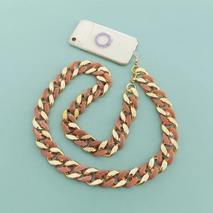Detail view of pink resin and gold metal chunky chain strap with secure clips